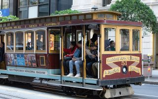 people riding the San Francisco Tram